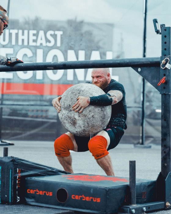 Strongman carrying an atlas stone
